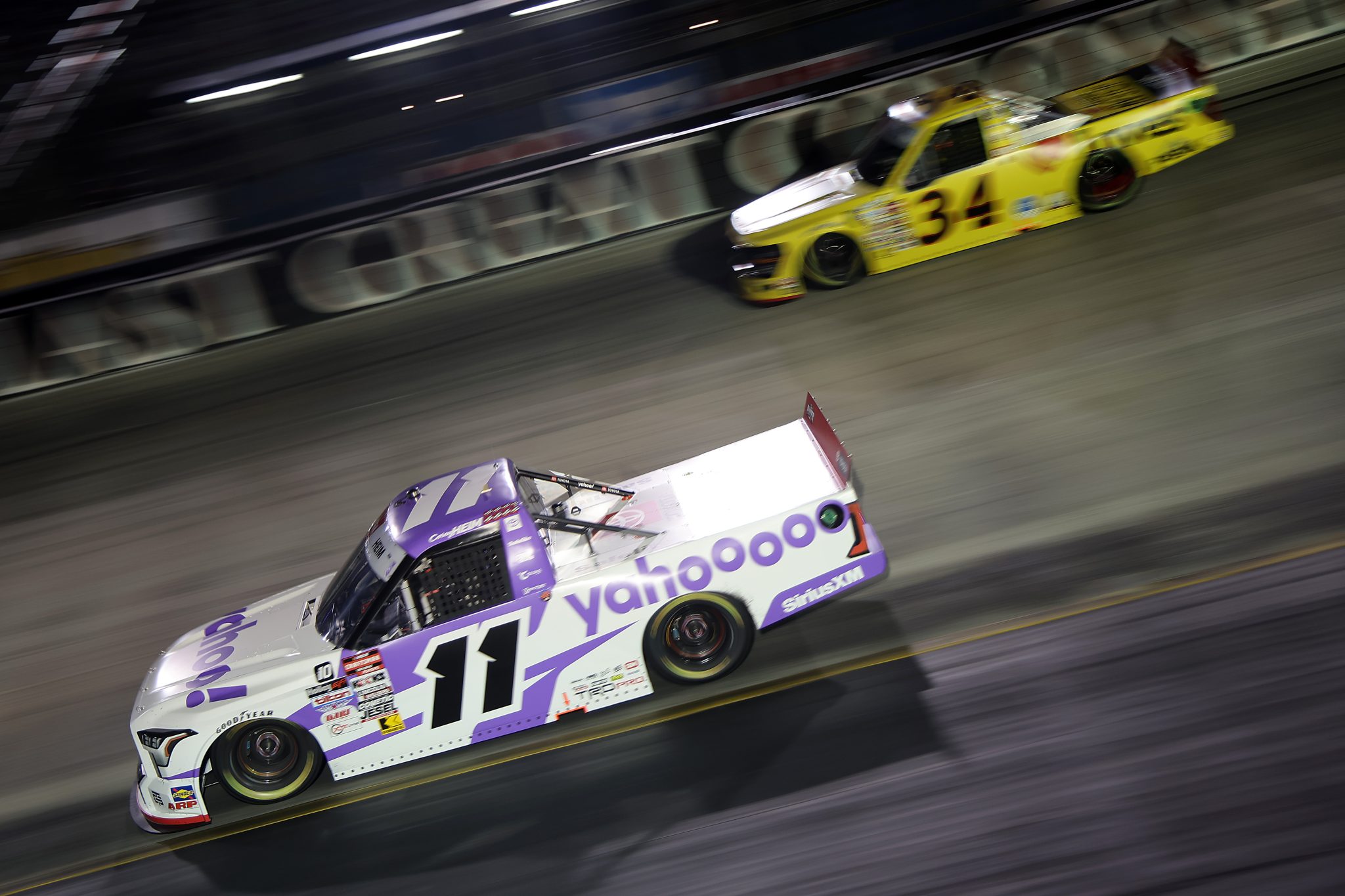 BRISTOL, TENNESSEE - SEPTEMBER 11: Corey Heim, driver of the #11 Yahoo! Toyota, and Layne Riggs, driver of the #34 Love's RV STOP Ford, race during the NASCAR Craftsman Truck Series UNOH 200 presented by Ohio Logistics at Bristol Motor Speedway on September 11, 2025 in Bristol, Tennessee. (Photo by Jonathan Bachman/Getty Images) | Getty Images