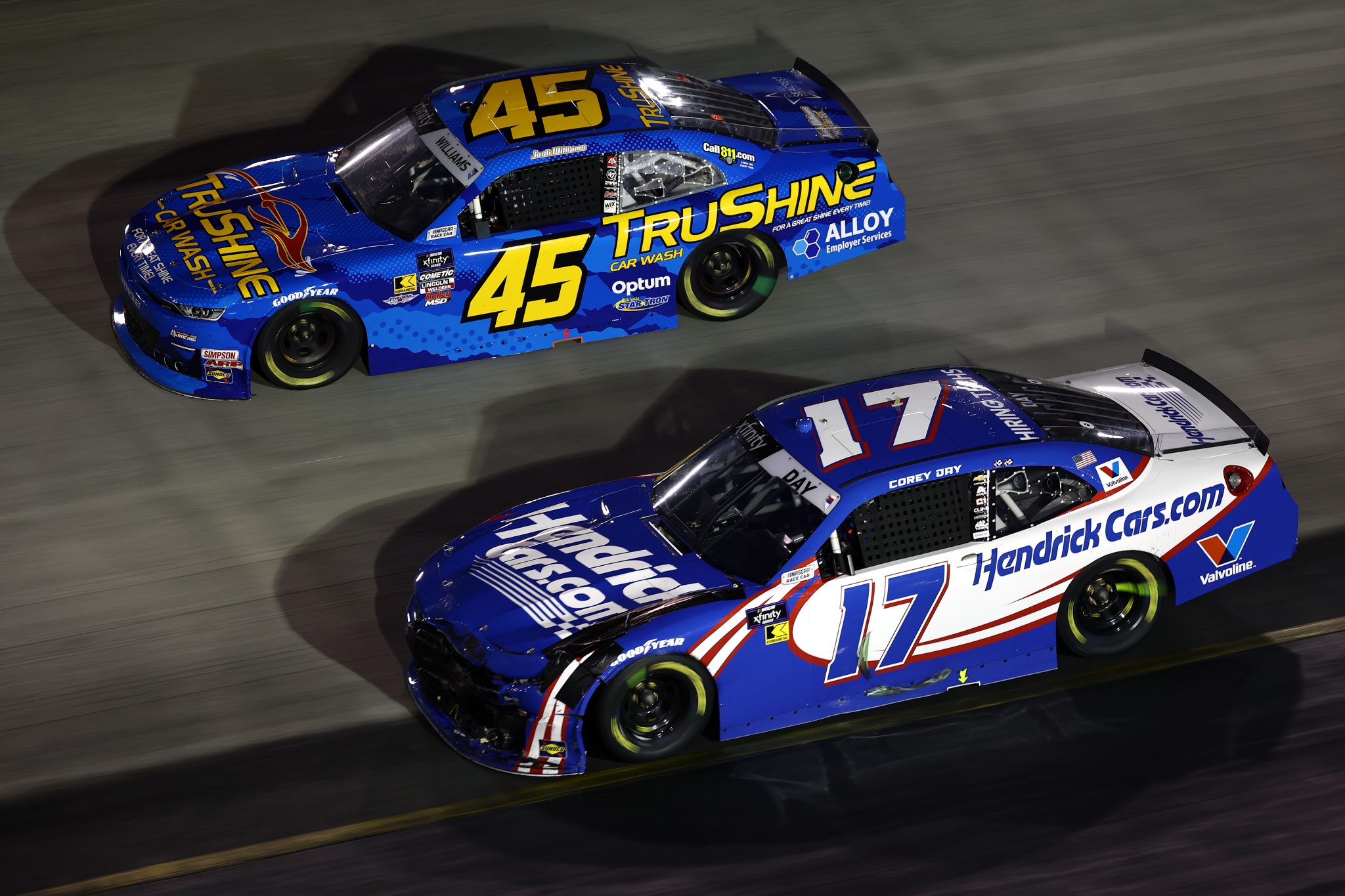 BRISTOL, TENNESSEE - SEPTEMBER 12: Corey Day, driver of the #17 HendrickCars.com Chevrolet, and Josh Williams, driver of the #45 TruShine Car Wash Chevrolet, race during the NASCAR Xfinity Series Food City 300 at Bristol Motor Speedway on September 12, 2025 in Bristol, Tennessee. (Photo by Jared C. Tilton/Getty Images) | Getty Images