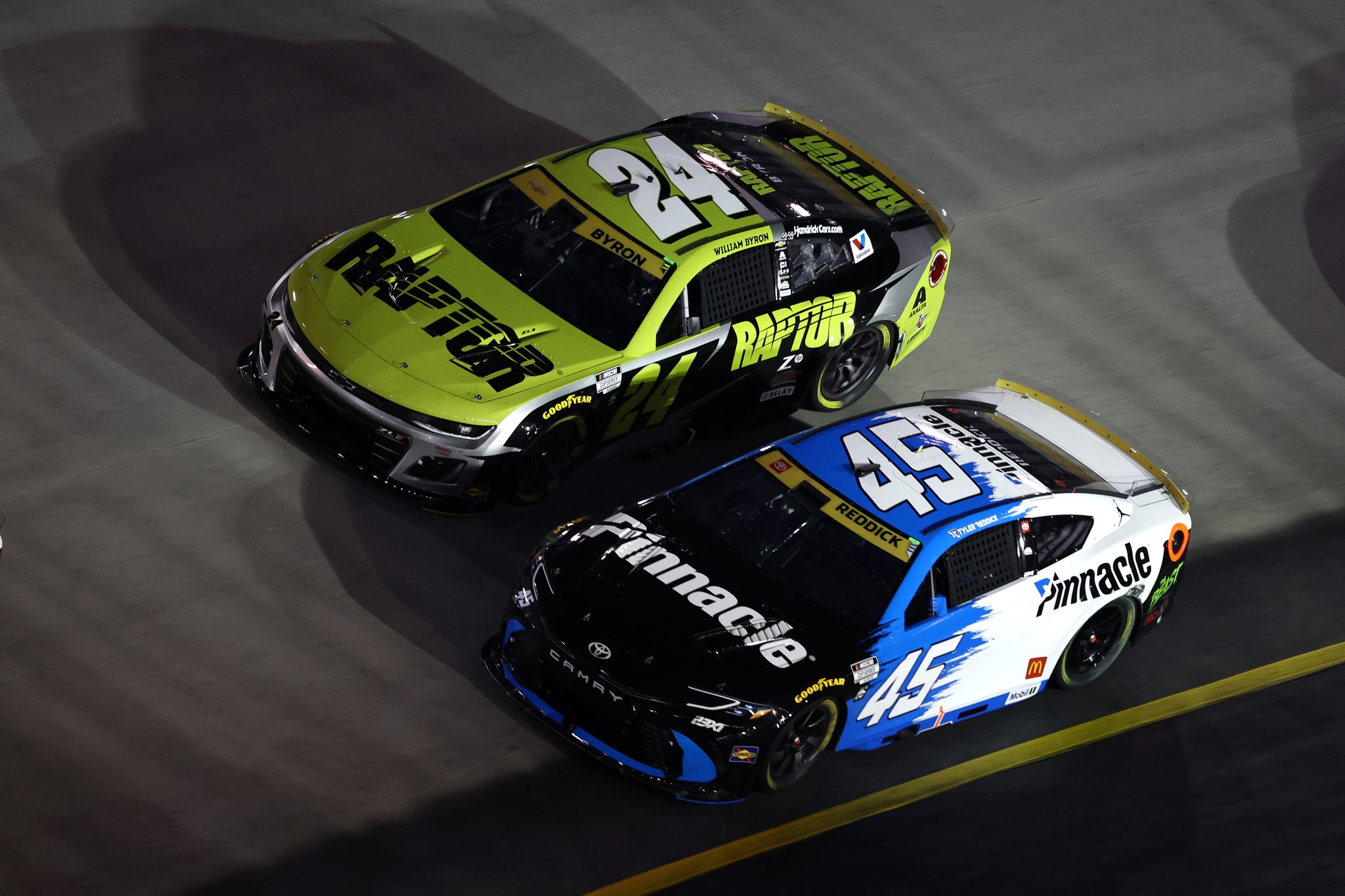 BRISTOL, TENNESSEE - SEPTEMBER 13: Tyler Reddick, driver of the #45 Pinnacle Toyota, and William Byron, driver of the #24 Raptor Chevrolet, race during the NASCAR Cup Series Bass Pro Shops Night Race at Bristol Motor Speedway on September 13, 2025 in Bristol, Tennessee. (Photo by Jared C. Tilton/Getty Images) | Getty Images