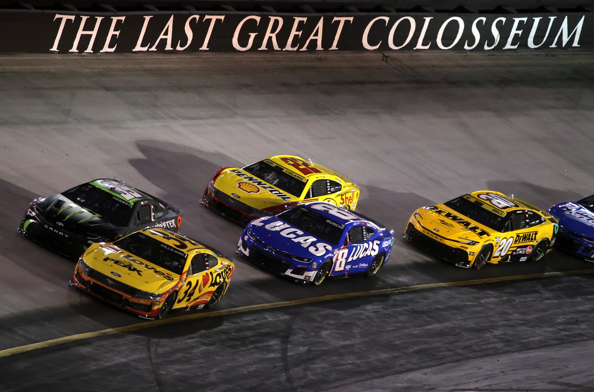 BRISTOL, TENNESSEE - SEPTEMBER 13: Ty Gibbs, driver of the #54 Monster Energy Toyota, Todd Gilliland, driver of the #34 Love's Travel Stops Ford, Kyle Busch, driver of the #8 Lucas Oil Chevrolet, Joey Logano, driver of the #22 Shell Pennzoil Ford, and Christopher Bell, driver of the #20 DEWALT Toyota, race during the NASCAR Cup Series Bass Pro Shops Night Race at Bristol Motor Speedway on September 13, 2025 in Bristol, Tennessee. (Photo by Jonathan Bachman/Getty Images) | Getty Images