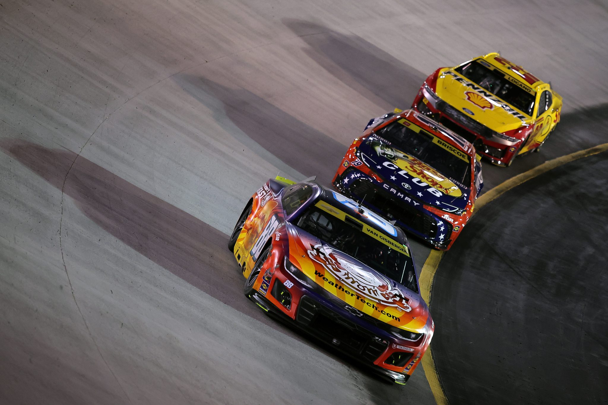 BRISTOL, TENNESSEE - SEPTEMBER 13: Shane Van Gisbergen, driver of the #88 Wendy's Breakfast Baconator Chevrolet, Chase Briscoe, driver of the #19 Bass Pro Shops Toyota, and Joey Logano, driver of the #22 Shell Pennzoil Ford, race during the NASCAR Cup Series Bass Pro Shops Night Race at Bristol Motor Speedway on September 13, 2025 in Bristol, Tennessee. (Photo by Jonathan Bachman/Getty Images) | Getty Images