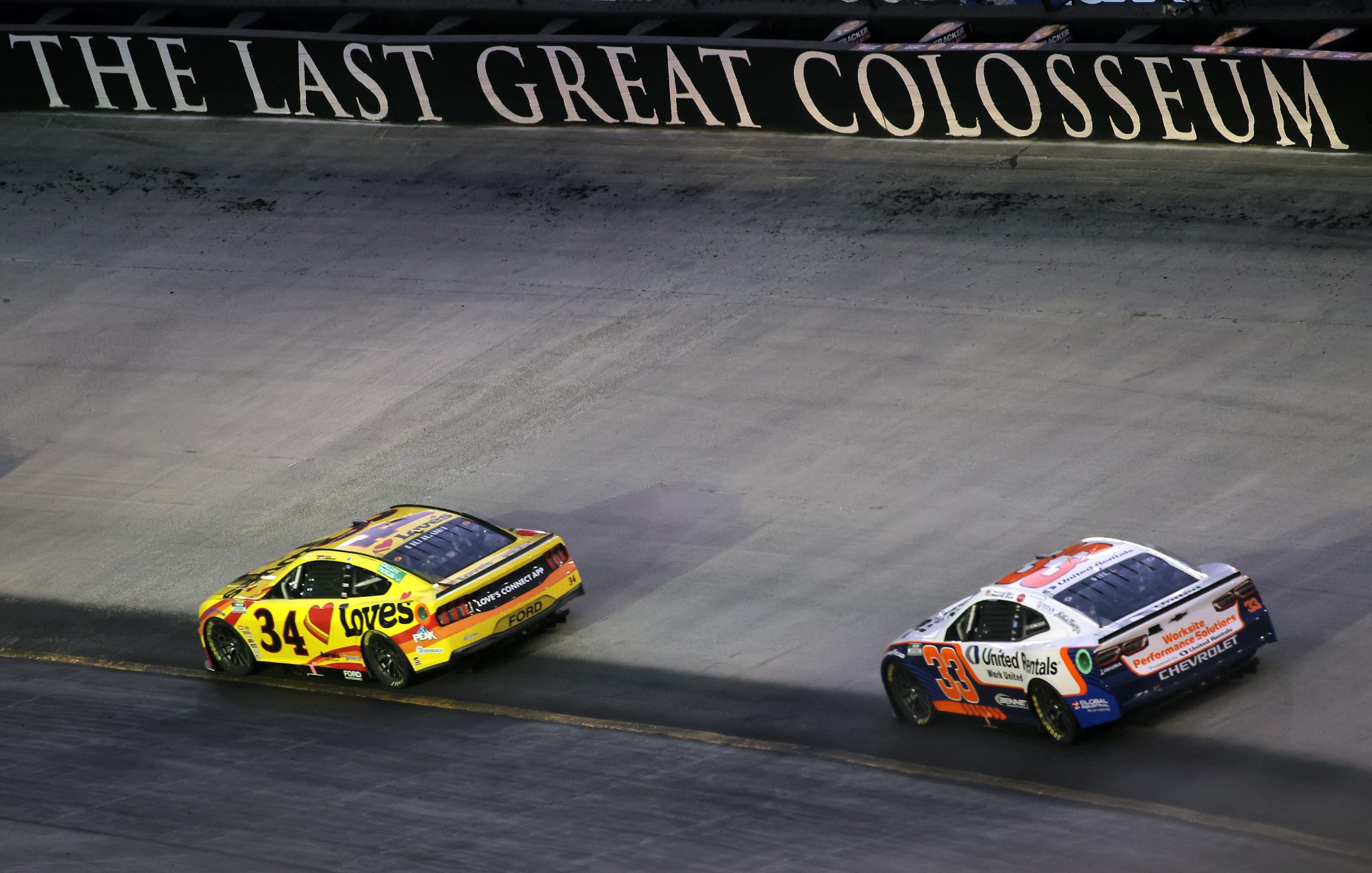 BRISTOL, TENNESSEE - SEPTEMBER 13: Todd Gilliland, driver of the #34 Love's Travel Stops Ford, and Austin Hill, driver of the #33 United Rentals Chevrolet, race during the NASCAR Cup Series Bass Pro Shops Night Race at Bristol Motor Speedway on September 13, 2025 in Bristol, Tennessee. (Photo by Jonathan Bachman/Getty Images) | Getty Images