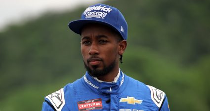 LAKEVILLE, CONNECTICUT - JUNE 27: Rajah Caruth, driver of the #71 HendrickCars.com Chevrolet, walks the grid during practice for the NASCAR Craftsman Truck Series LiUNA! 150 at Lime Rock Park on June 27, 2025 in Lakeville, Connecticut. (Photo by Jonathan Bachman/Getty Images) | Getty Images