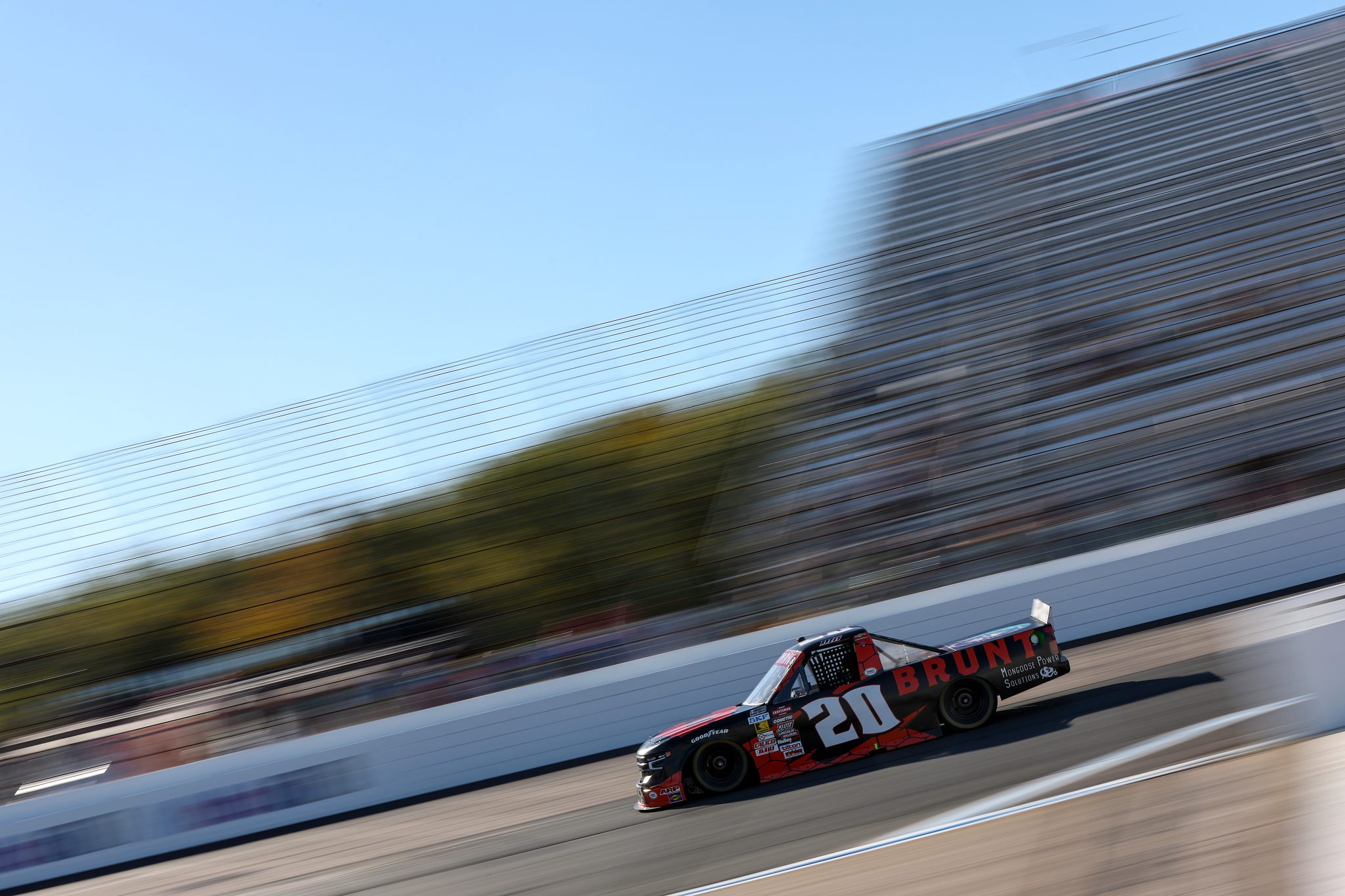 LOUDON, NEW HAMPSHIRE - SEPTEMBER 19: Mason Massey, driver of the #20 BRUNT Chevrolet, drives during practice for the NASCAR Craftsman Truck Series Team EJP 175 at New Hampshire Motor Speedway on September 19, 2025 in Loudon, New Hampshire. (Photo by Meg Oliphant/Getty Images) | Getty Images