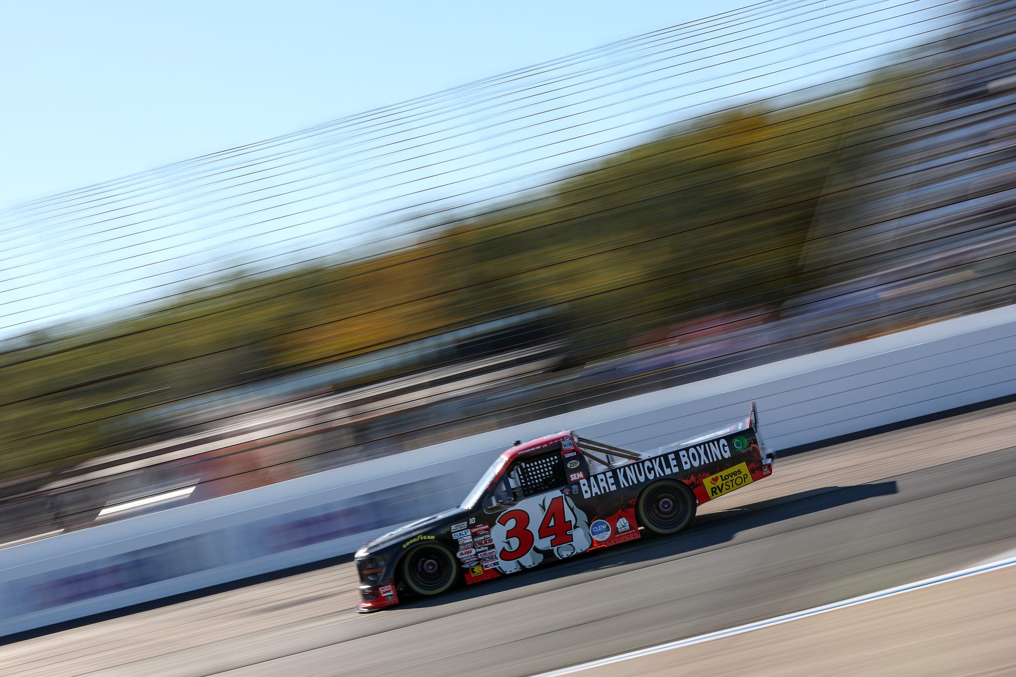 LOUDON, NEW HAMPSHIRE - SEPTEMBER 19: Layne Riggs, driver of the #34 Bare Knuckle Brawl Ford, drives during practice for the NASCAR Craftsman Truck Series Team EJP 175 at New Hampshire Motor Speedway on September 19, 2025 in Loudon, New Hampshire. (Photo by Meg Oliphant/Getty Images) | Getty Images