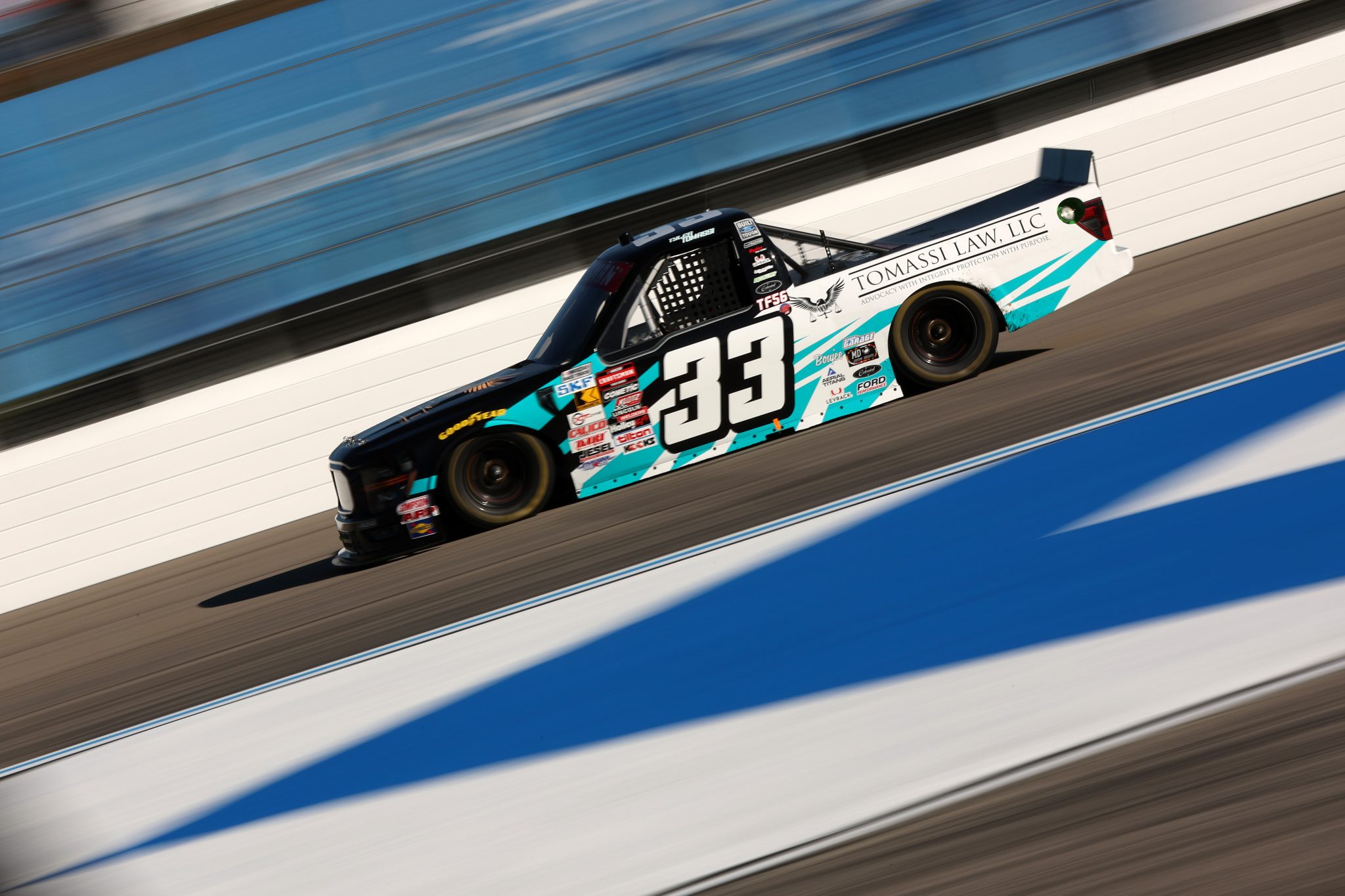 LOUDON, NEW HAMPSHIRE - SEPTEMBER 19: Tyler Tomassi, driver of the #33 Tomassi Law LLC Ford, drives during practice for the NASCAR Craftsman Truck Series Team EJP 175 at New Hampshire Motor Speedway on September 19, 2025 in Loudon, New Hampshire. (Photo by Meg Oliphant/Getty Images) | Getty Images