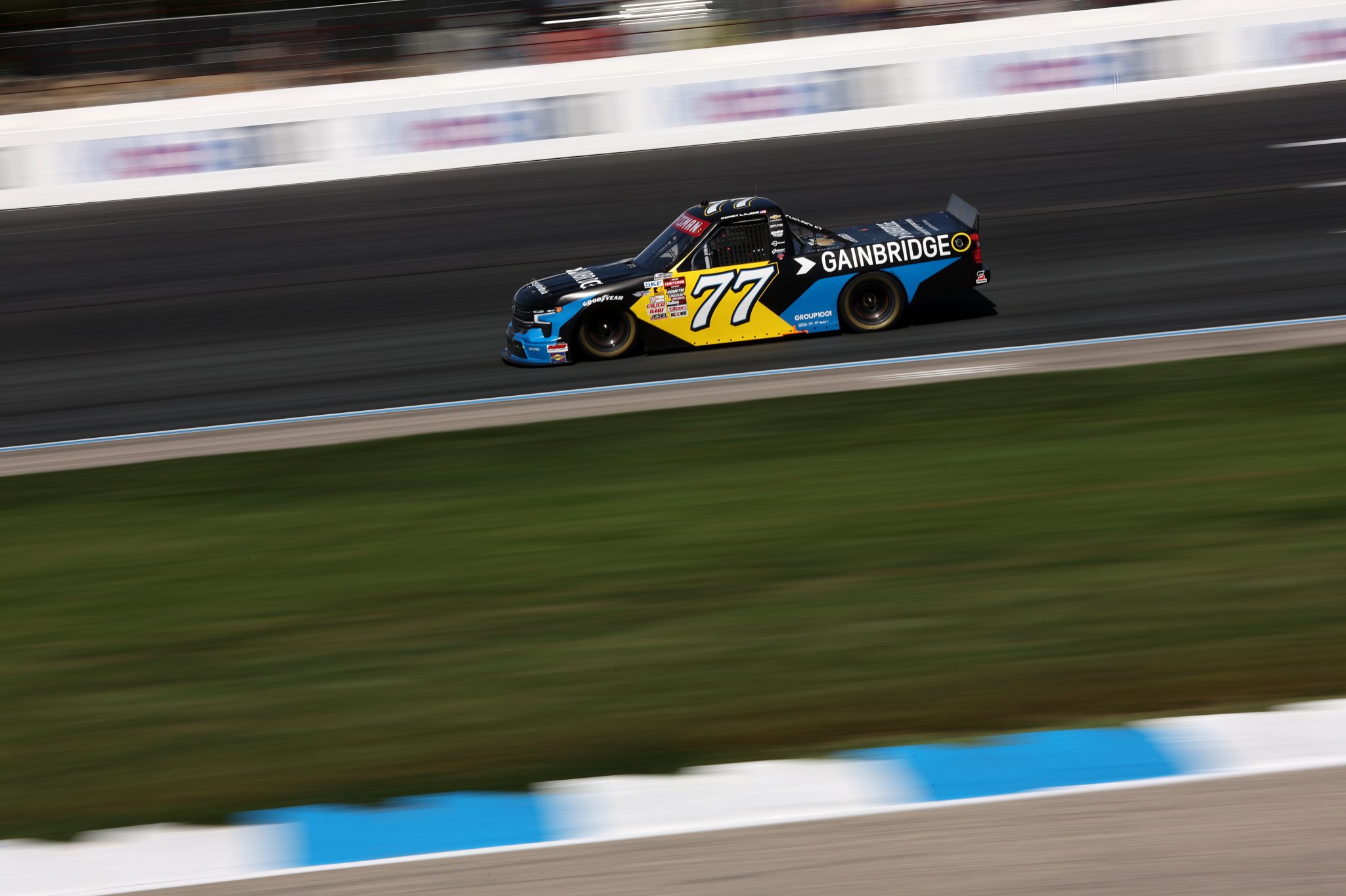 LOUDON, NEW HAMPSHIRE - SEPTEMBER 20: Corey LaJoie, driver of the #77 Gainbridge Chevrolet, drives during the NASCAR Craftsman Truck Series Team EJP 175 at New Hampshire Motor Speedway on September 20, 2025 in Loudon, New Hampshire. (Photo by Meg Oliphant/Getty Images) | Getty Images