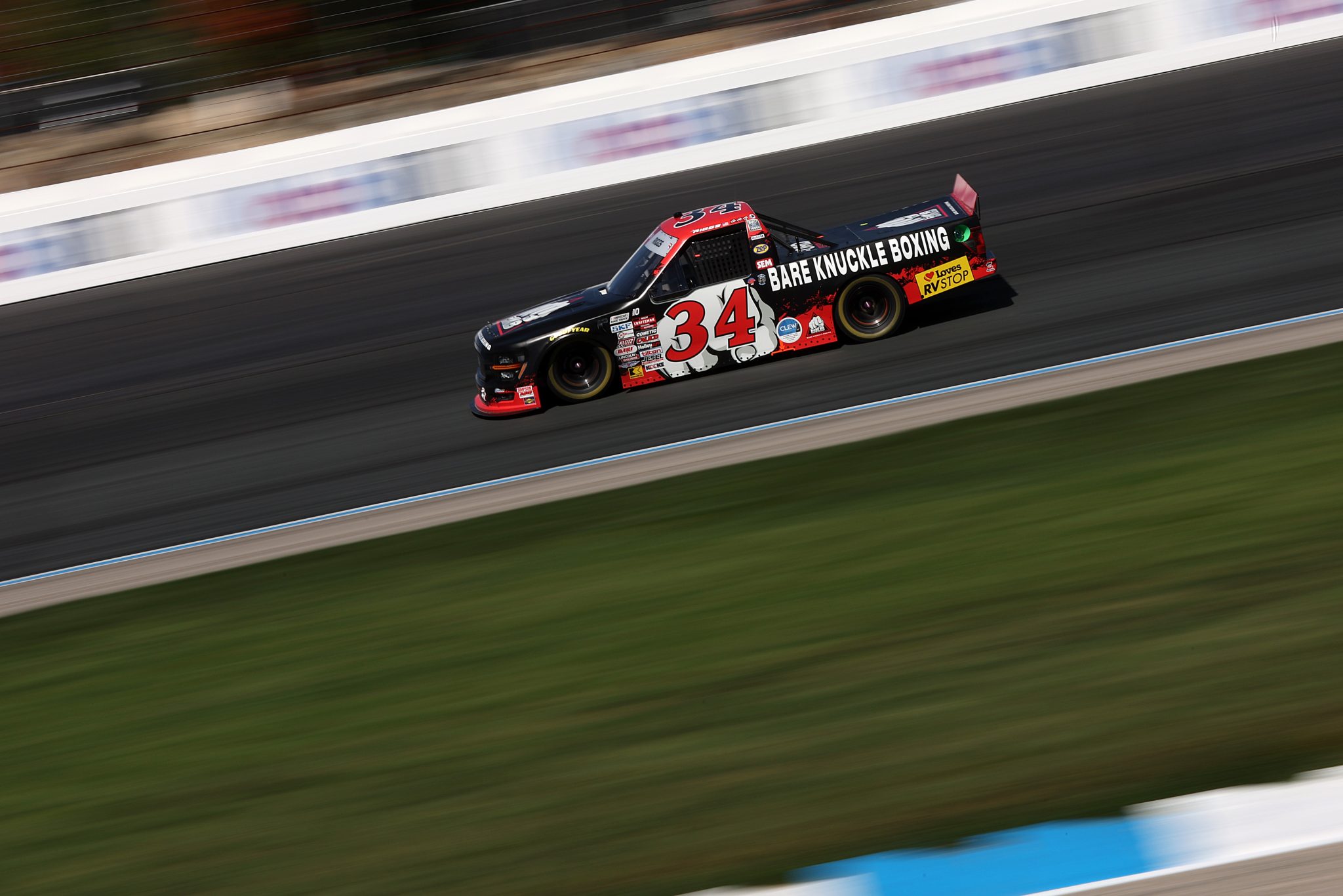 LOUDON, NEW HAMPSHIRE - SEPTEMBER 20: Layne Riggs, driver of the #34 Bare Knuckle Brawl Ford, drives during the NASCAR Craftsman Truck Series Team EJP 175 at New Hampshire Motor Speedway on September 20, 2025 in Loudon, New Hampshire. (Photo by Meg Oliphant/Getty Images) | Getty Images