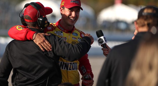 LOUDON, NEW HAMPSHIRE - SEPTEMBER 20: Joey Logano, driver of the #22 Shell Pennzoil Ford, celebrates with crew after winning the pole during qualifying for the NASCAR Cup Series Mobil 1 301 at New Hampshire Motor Speedway on September 20, 2025 in Loudon, New Hampshire. (Photo by Meg Oliphant/Getty Images) | Getty Images