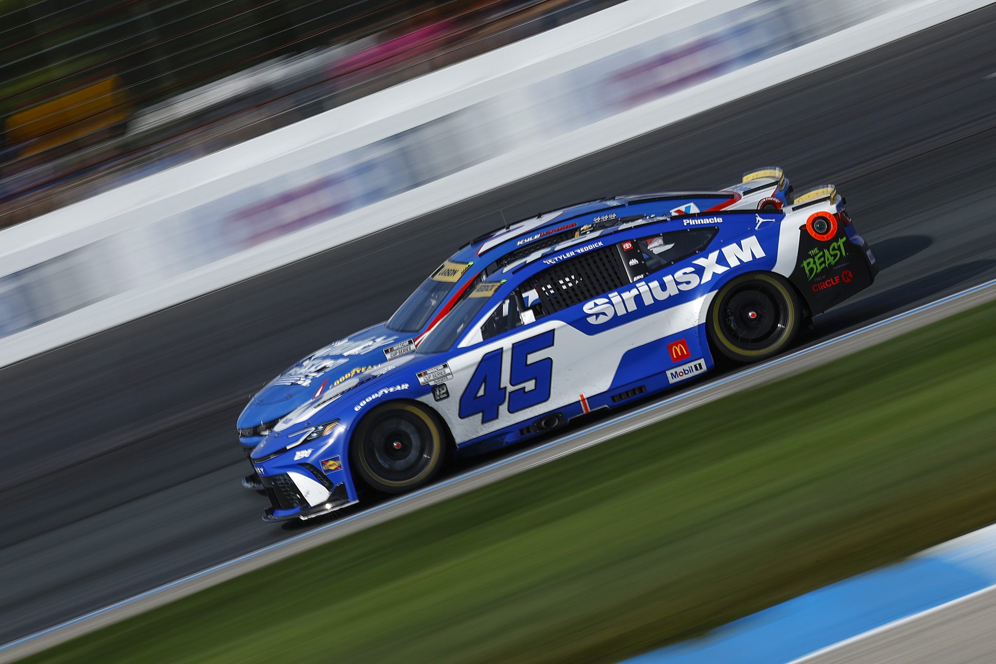 LOUDON, NEW HAMPSHIRE - SEPTEMBER 21: Tyler Reddick, driver of the #45 SiriusXM Toyota, and Kyle Larson, driver of the #5 HendrickCars.com Chevrolet, race during the NASCAR Cup Series Mobil 1 301 at New Hampshire Motor Speedway on September 21, 2025 in Loudon, New Hampshire. (Photo by Sean Gardner/Getty Images) | Getty Images