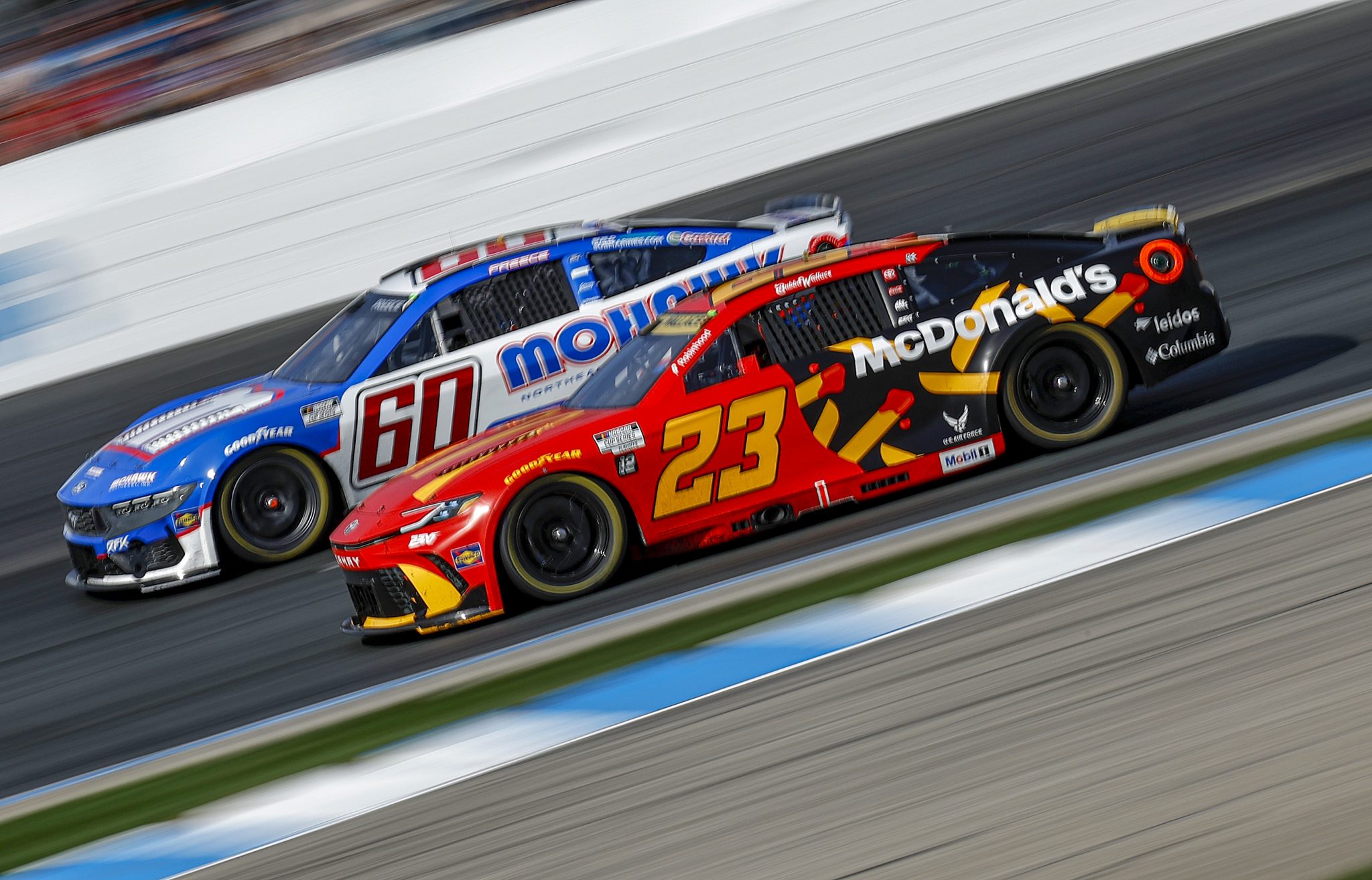 LOUDON, NEW HAMPSHIRE - SEPTEMBER 21: Bubba Wallace, driver of the #23 McDonald's Toyota, and Ryan Preece, driver of the #60 Mohawk Northeast Inc. Ford, race during the NASCAR Cup Series Mobil 1 301 at New Hampshire Motor Speedway on September 21, 2025 in Loudon, New Hampshire. (Photo by Sean Gardner/Getty Images) | Getty Images