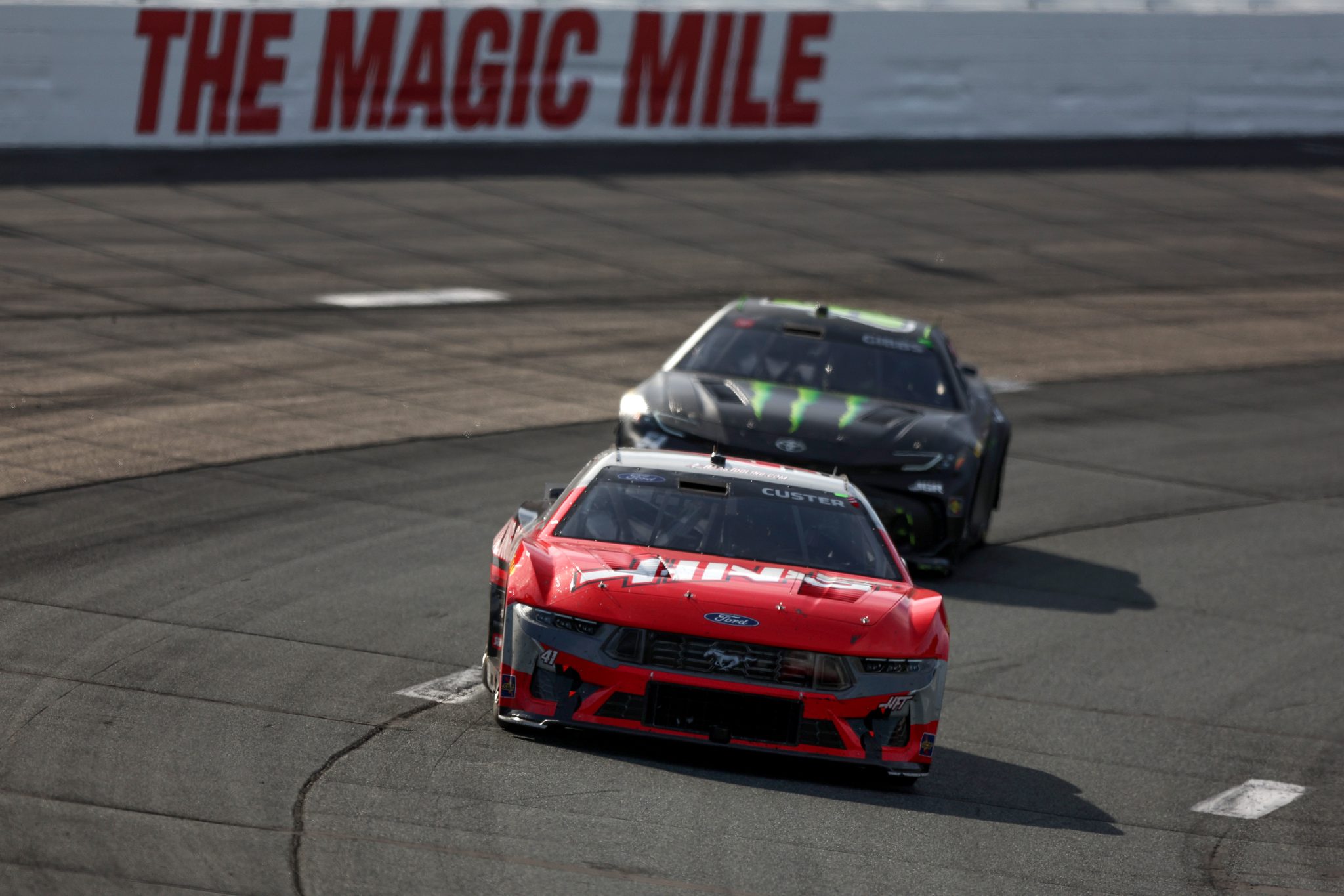 LOUDON, NEW HAMPSHIRE - SEPTEMBER 21: Cole Custer, driver of the #41 HaasTooling.com Ford, and Ty Gibbs, driver of the #54 Monster Energy Toyota, race during the NASCAR Cup Series Mobil 1 301 at New Hampshire Motor Speedway on September 21, 2025 in Loudon, New Hampshire. (Photo by Meg Oliphant/Getty Images) | Getty Images