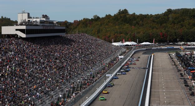 LOUDON, NEW HAMPSHIRE - SEPTEMBER 21: A general view of Ryan Blaney, driver of the #12 Menards/Libman Ford, leading the field during the NASCAR Cup Series Mobil 1 301 at New Hampshire Motor Speedway on September 21, 2025 in Loudon, New Hampshire. (Photo by Meg Oliphant/Getty Images) | Getty Images