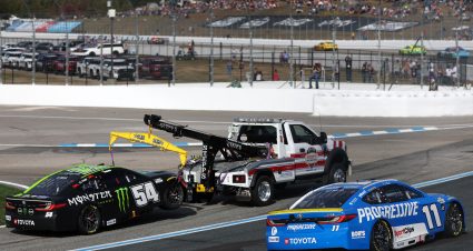 LOUDON, NEW HAMPSHIRE - SEPTEMBER 21: Ty Gibbs, driver of the #54 Monster Energy Toyota, is towed after an on-track incident as Denny Hamlin, driver of the #11 Progressive Toyota, drives during the NASCAR Cup Series Mobil 1 301 at New Hampshire Motor Speedway on September 21, 2025 in Loudon, New Hampshire. (Photo by Meg Oliphant/Getty Images) | Getty Images