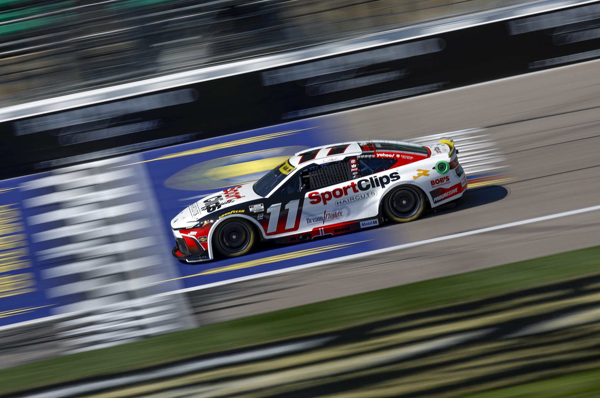 KANSAS CITY, KANSAS - SEPTEMBER 27: Denny Hamlin, driver of the #11 Sport Clips Haircuts Toyota, drives during practice for the NASCAR Cup Series Hollywood Casino 400 Presented by ESPN BET at Kansas Speedway on September 27, 2025 in Kansas City, Kansas. (Photo by Sean Gardner/Getty Images) | Getty Images