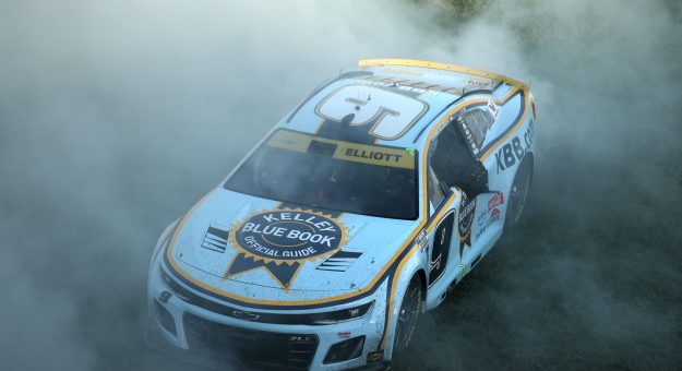 KANSAS CITY, KANSAS - SEPTEMBER 28: Chase Elliott, driver of the #9 Kelley Blue Book Chevrolet, celebrates with a burnout after winning the NASCAR Cup Series Hollywood Casino 400 Presented by ESPN BET at Kansas Speedway on September 28, 2025 in Kansas City, Kansas. (Photo by Chris Graythen/Getty Images) | Getty Images