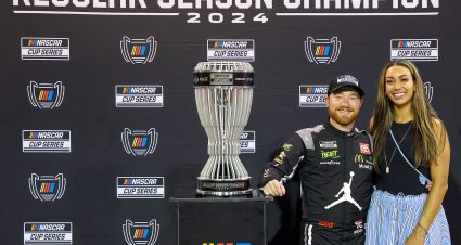 DARLINGTON, SOUTH CAROLINA - SEPTEMBER 01: 2024 Regular Season Champion, Tyler Reddick, driver of the #45 Upper Deck Toyota, poses with his wife, Alexa De Leon after the NASCAR Cup Series Cook Out Southern 500 at Darlington Raceway on September 01, 2024 in Darlington, South Carolina. (Photo by Meg Oliphant/Getty Images) | Getty Images