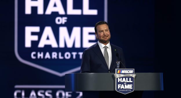 CHARLOTTE, NORTH CAROLINA - JANUARY 23: NASCAR Hall of Fame inductee Kurt Busch speaks onstage during the NASCAR Hall of Fame Induction Ceremony at Charlotte Convention Center on January 23, 2026 in Charlotte, North Carolina.  (Photo by David Jensen/Getty Images) | Getty Images