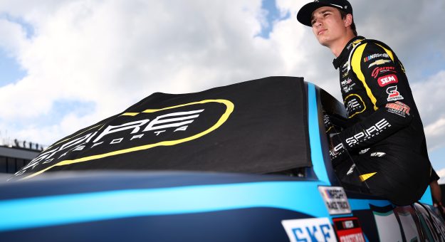 LOUDON, NEW HAMPSHIRE - AUGUST 21: Tristan McKee, driver of the #77 Delaware Life Chevrolet, enters his truck during qualifying for the NASCAR Craftsman Truck Series Team EJP 175 at New Hampshire Motor Speedway on August 21, 2026 in Loudon, New Hampshire. (Photo by Meg Oliphant/Getty Images) | Getty Images