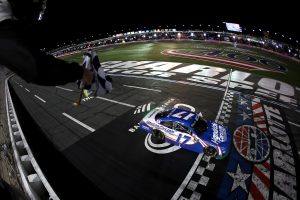 CONCORD, NORTH CAROLINA - OCTOBER 11: Corey Day, driver of the #17 HendrickCars.com Chevrolet, takes the checkered flag to win the NASCAR O'Reilly Auto Parts Series Blue Cross NC 300 at Charlotte Motor Speedway on October 11, 2026 in Concord, North Carolina. (Photo by Jared C. Tilton/Getty Images) | Getty Images