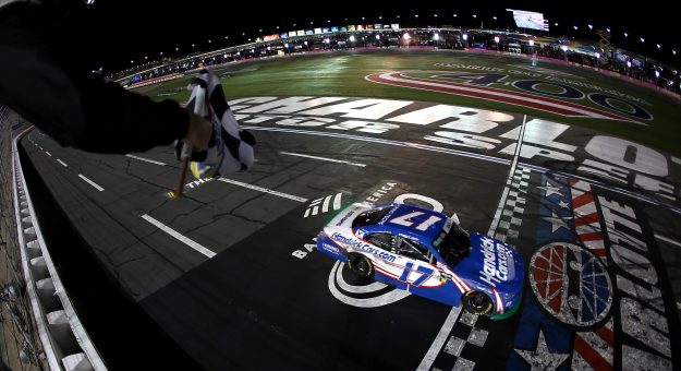 CONCORD, NORTH CAROLINA - OCTOBER 11: Corey Day, driver of the #17 HendrickCars.com Chevrolet, takes the checkered flag to win the NASCAR O'Reilly Auto Parts Series Blue Cross NC 300 at Charlotte Motor Speedway on October 11, 2026 in Concord, North Carolina. (Photo by Jared C. Tilton/Getty Images) | Getty Images