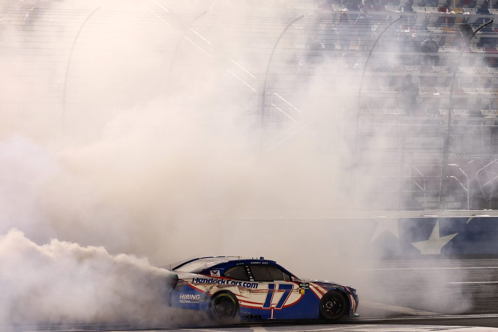 CONCORD, NORTH CAROLINA - OCTOBER 11: Corey Day, driver of the #17 HendrickCars.com Chevrolet, celebrates with a burnout after winning the NASCAR O'Reilly Auto Parts Series Blue Cross NC 300 at Charlotte Motor Speedway on October 11, 2026 in Concord, North Carolina. (Photo by David Jensen/Getty Images) | Getty Images