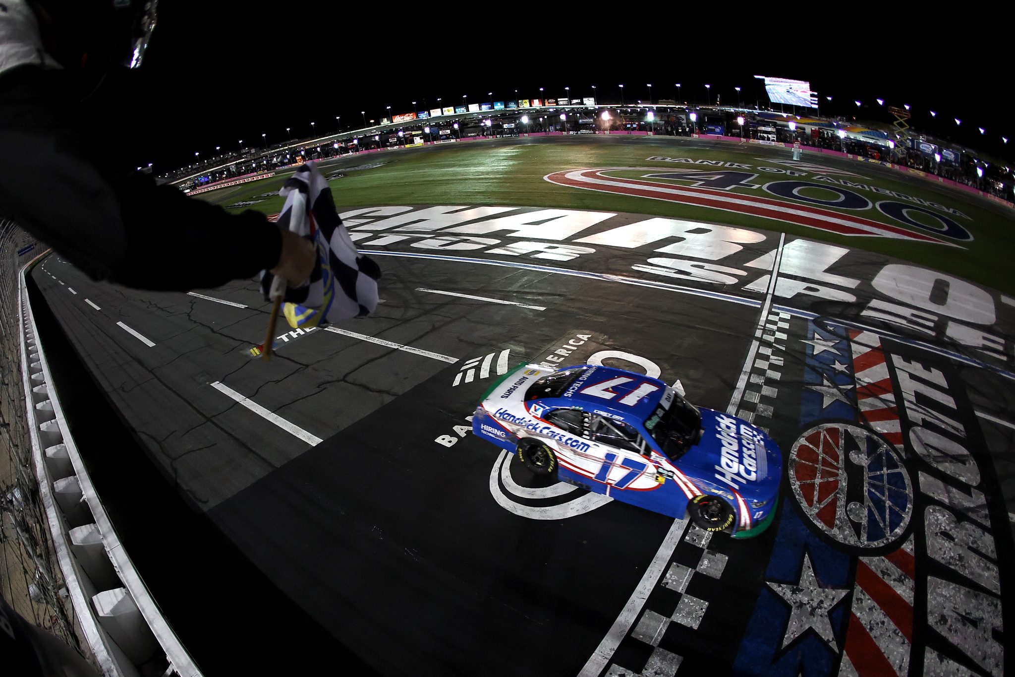 CONCORD, NORTH CAROLINA - OCTOBER 11: Corey Day, driver of the #17 HendrickCars.com Chevrolet, takes the checkered flag to win the NASCAR O'Reilly Auto Parts Series Blue Cross NC 300 at Charlotte Motor Speedway on October 11, 2026 in Concord, North Carolina. (Photo by Jared C. Tilton/Getty Images) | Getty Images