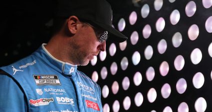 CONCORD, NORTH CAROLINA - OCTOBER 11: Denny Hamlin, driver of the #11 Progressive Insurance Toyota, waits backstage during pre-race ceremonies prior to the NASCAR Cup Series Bank of America 400 at Charlotte Motor Speedway on October 11, 2026 in Concord, North Carolina. (Photo by David Jensen/Getty Images) | Getty Images