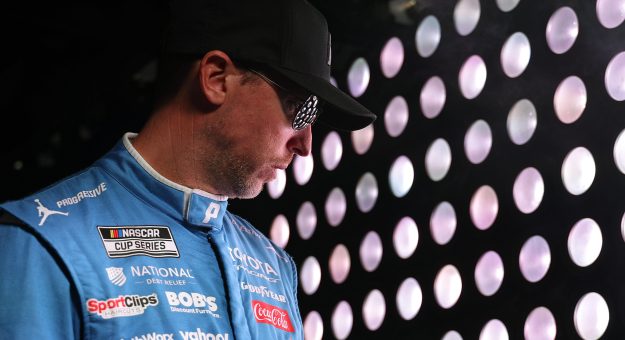 CONCORD, NORTH CAROLINA - OCTOBER 11: Denny Hamlin, driver of the #11 Progressive Insurance Toyota, waits backstage during pre-race ceremonies prior to the NASCAR Cup Series Bank of America 400 at Charlotte Motor Speedway on October 11, 2026 in Concord, North Carolina. (Photo by David Jensen/Getty Images) | Getty Images