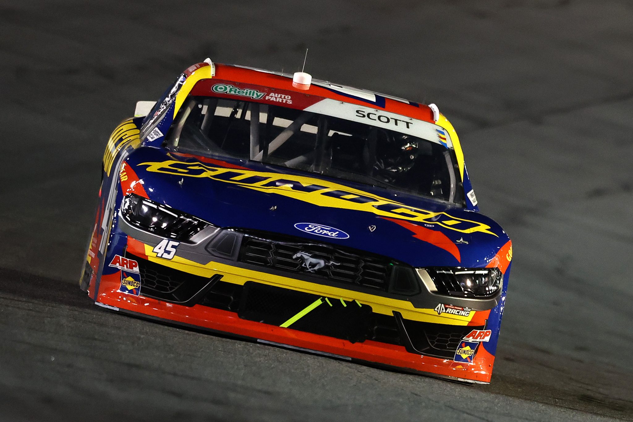CONCORD, NORTH CAROLINA - OCTOBER 11: Lavar Scott, driver of the #45 Sunoco Ford, drives during the NASCAR O'Reilly Auto Parts Series Blue Cross NC 300 at Charlotte Motor Speedway on October 11, 2026 in Concord, North Carolina. (Photo by David Jensen/Getty Images) | Getty Images