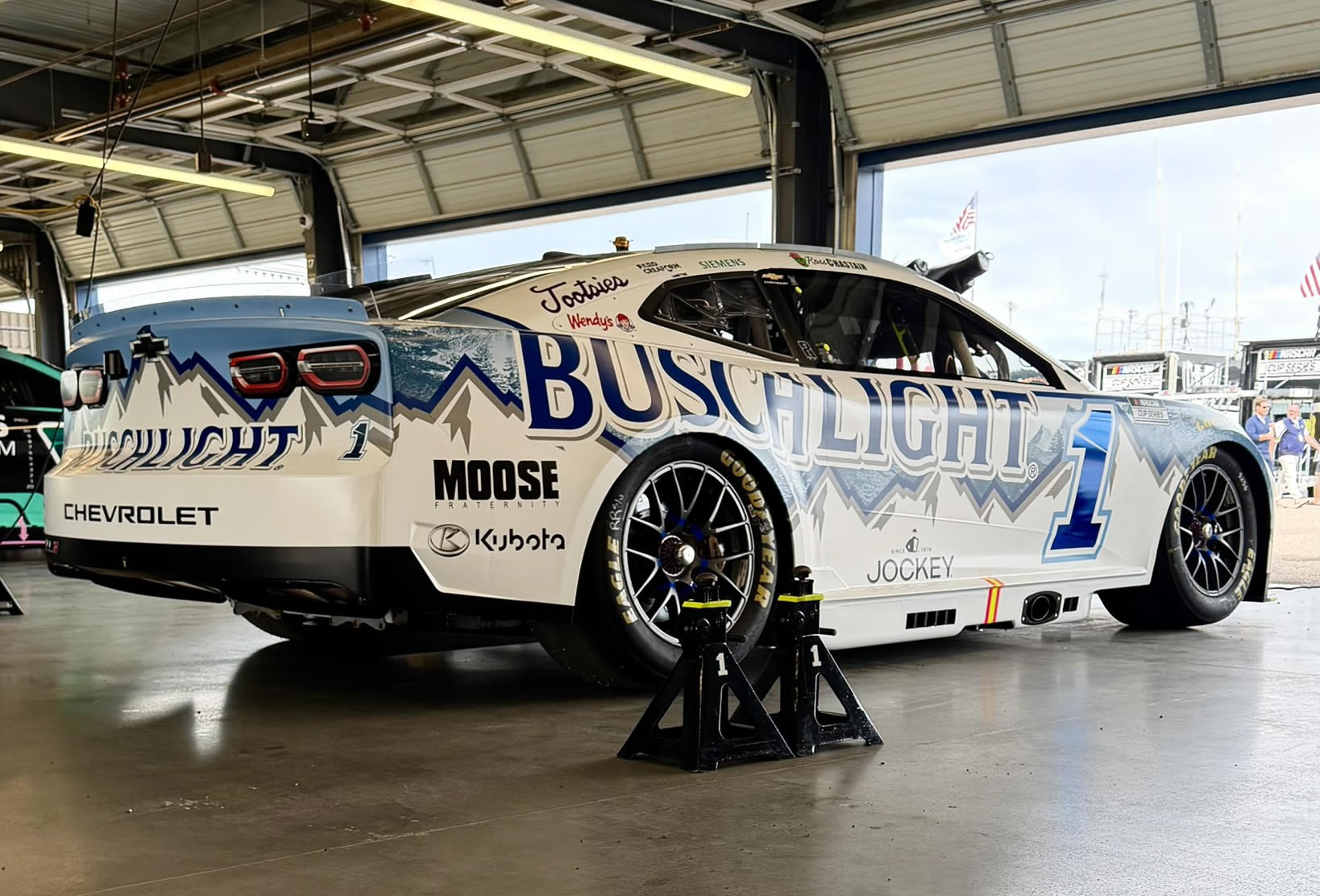 AVONDALE, ARIZONA - OCTOBER 17: Ross Chastain, driver of the #1 Busch Light Chevrolet, sits in the garage during practice for the NASCAR Cup Series Freeway Insurance 500 at Phoenix Raceway on October 17, 2026 in Avondale, Arizona. (Photo from Trackhouse Racing)