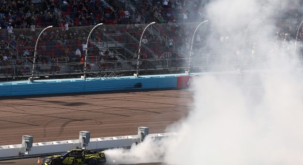 AVONDALE, ARIZONA - OCTOBER 18: Tyler Reddick, driver of the #45 ROCKSTAR ENERGY DRINK Toyota, celebrates with a burnout after winning the NASCAR Cup Series Freeway Insurance 500 at Phoenix Raceway on October 18, 2026 in Avondale, Arizona. (Photo by Chris Graythen/Getty Images) | Getty Images