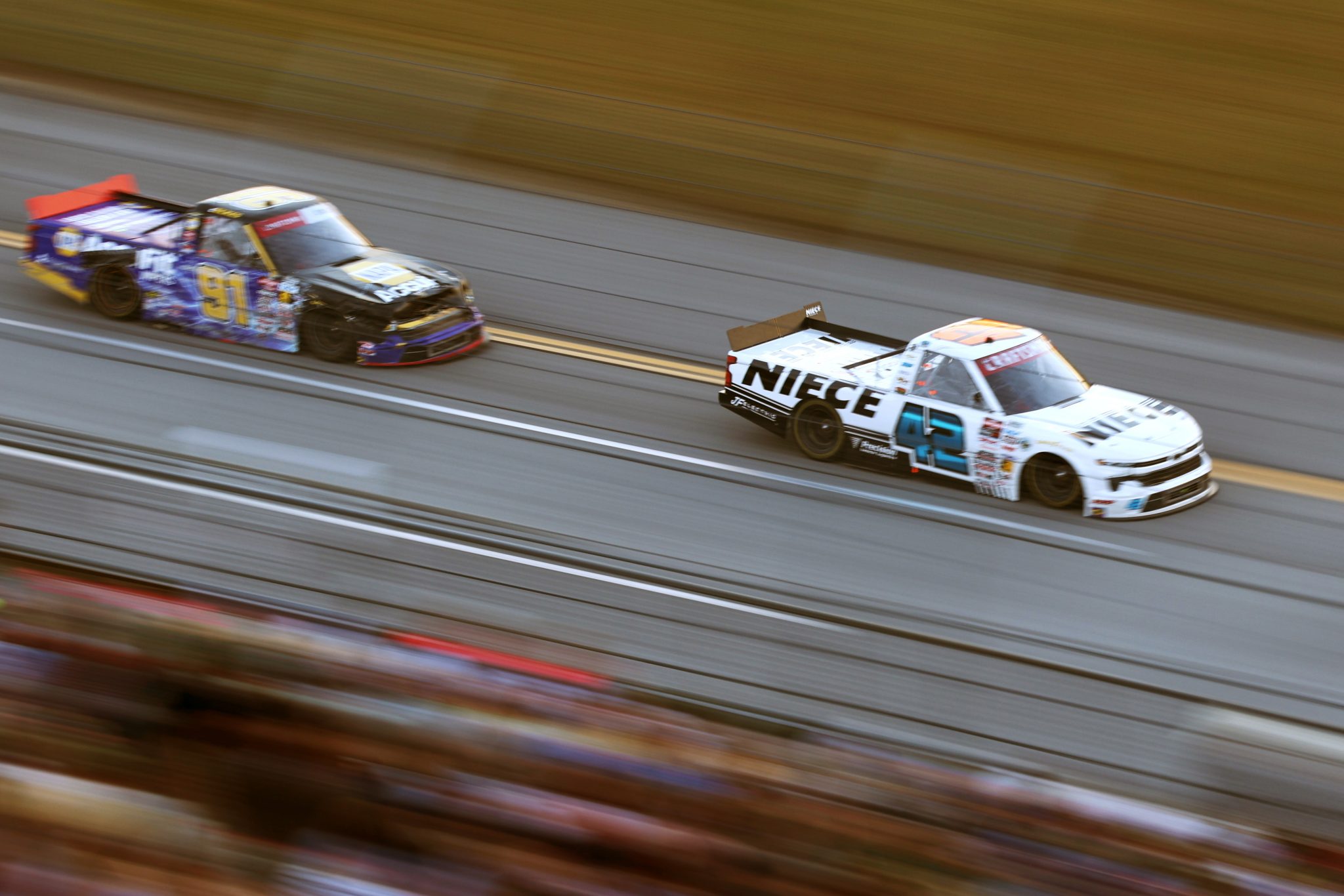 TALLADEGA, ALABAMA - OCTOBER 23: Conner Jones, driver of the #42 Niece Equipment Chevrolet, leads Christian Eckes, driver of the #91 NAPA AccuFit Chevrolet, during the NASCAR Craftsman Truck Series Love's RV Stop 225 at Talladega Superspeedway on October 23, 2026 in Talladega, Alabama. (Photo by Scott Taetsch/Getty Images) | Getty Images