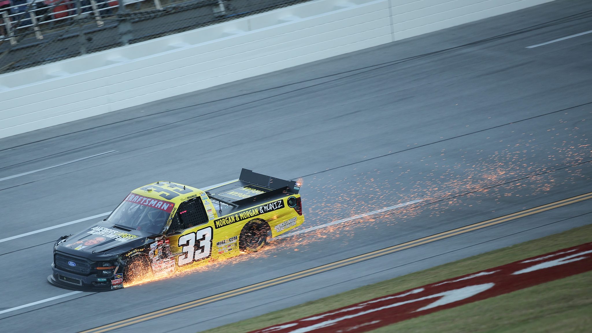 TALLADEGA, ALABAMA - OCTOBER 23: Frankie Muniz, driver of the #33 Morgan & Morgan Ford, drives as his truck sends sparks flying down the track during the NASCAR Craftsman Truck Series Love's RV Stop 225 at Talladega Superspeedway on October 23, 2026 in Talladega, Alabama. (Photo by Jonathan Bachman/Getty Images) | Getty Images