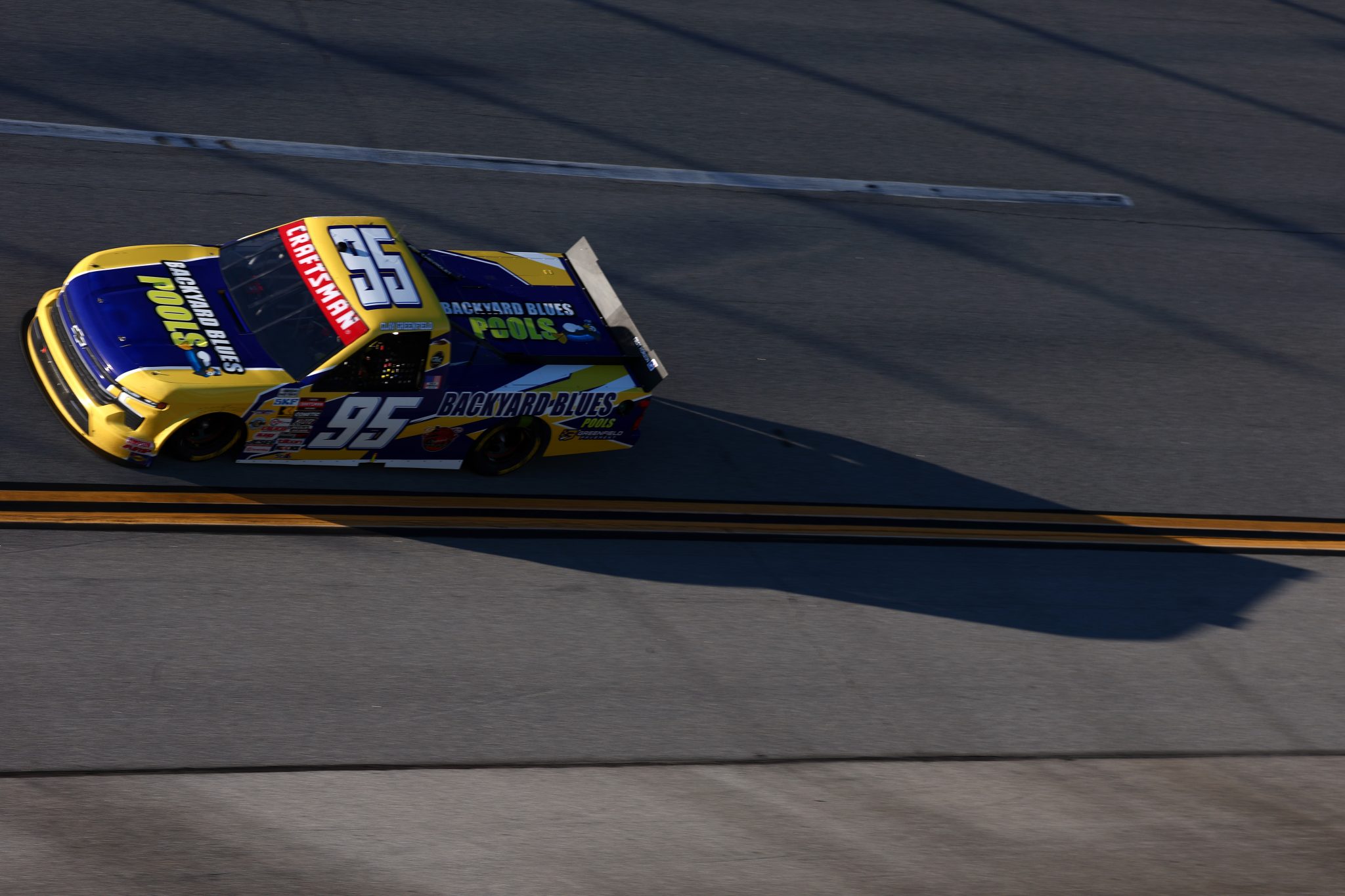 TALLADEGA, ALABAMA - OCTOBER 23: Clay Greenfield, driver of the #95 Backyard Blues Pools Chevrolet, drives during the NASCAR Craftsman Truck Series Love's RV Stop 225 at Talladega Superspeedway on October 23, 2026 in Talladega, Alabama. (Photo by Karl Anderson/Getty Images) | Getty Images