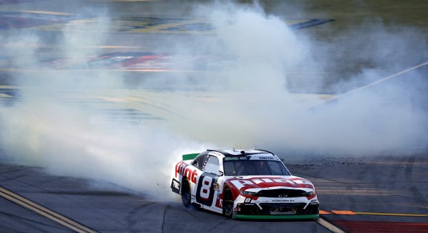 TALLADEGA, ALABAMA - OCTOBER 24: Sammy Smith, driver of the #8 Pilot Chevrolet, celebrates with a burnout after winning the NASCAR O'Reilly Auto Parts Series The Progress Group 250 at Talladega Superspeedway on October 24, 2026 in Talladega, Alabama. (Photo by Sean Gardner/Getty Images)