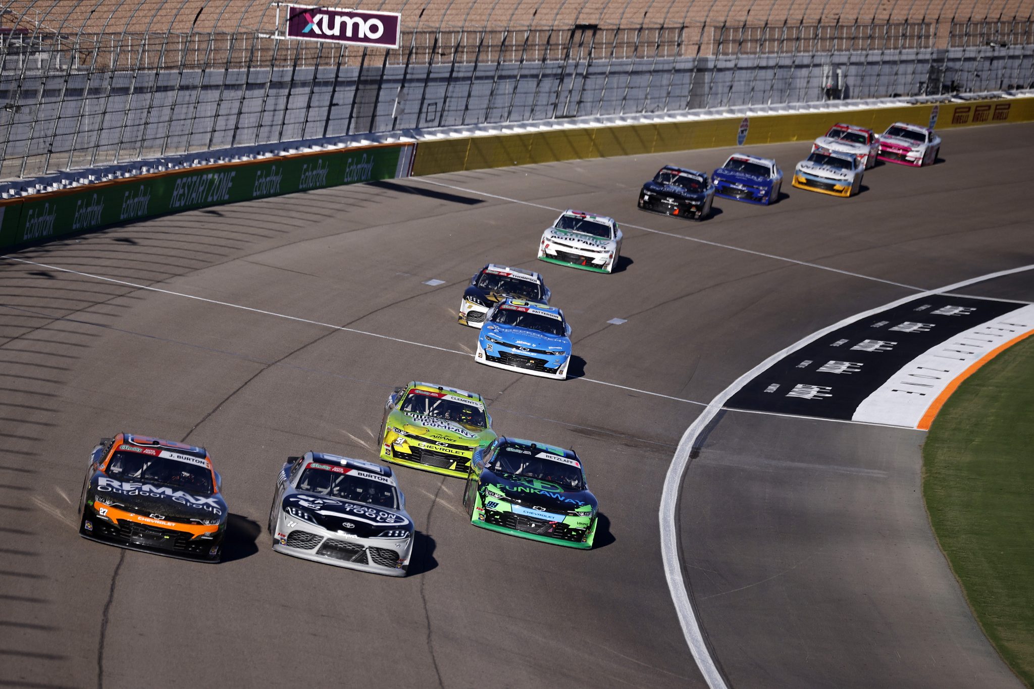 LAS VEGAS, NEVADA - OCTOBER 03: Jeb Burton, driver of the #27 RemaxOutdrGrp/Game&FishTV Chevrolet, Harrison Burton, driver of the #24 Dead On Tools Toyota, Jeremy Clements, driver of the #51 Pounds Pickle Co/Inception Energy Chevrolet, and Parker Retzlaff, driver of the #99 Funkaway Chevrolet, race during the NASCAR O'Reilly Auto Parts Series Focused Health 302 at Las Vegas Motor Speedway on October 03, 2026 in Las Vegas, Nevada. (Photo by Sean Gardner/Getty Images) | Getty Images