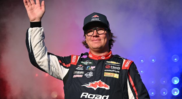 MADISON, ILLINOIS - SEPTEMBER 12: Sheldon Creed, driver of the #00 Road Ranger Chevrolet, waves to fans as he walks onstage during driver intros prior to the NASCAR O'Reilly Auto Parts Series Nu Way 225 Powered by Bobcat and Sauced by Blues Hog at WWT Raceway on September 12, 2026 in Madison, Illinois. (Photo by Amy Kontras/Getty Images) | Getty Images