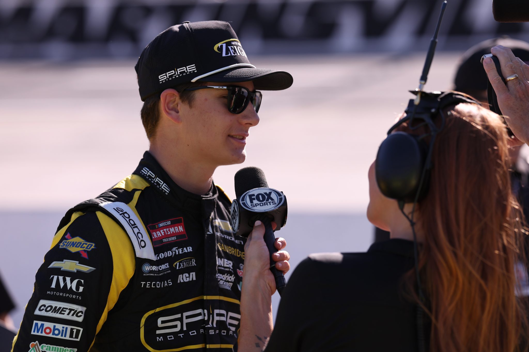 MARTINSVILLE, VIRGINIA - OCTOBER 30: Tristan McKee, driver of the #77 Zeigler Auto Group Chevrolet, is interviewed on the grid during qualifying for the NASCAR Craftsman Truck Series Black's Tire 200 presented by Down East Heating & Air Conditioning at Martinsville Speedway on October 30, 2026 in Martinsville, Virginia. (Photo by David Jensen/Getty Images) | Getty Images