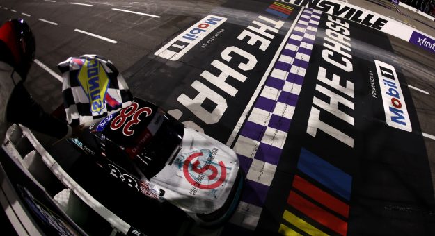 MARTINSVILLE, VIRGINIA - OCTOBER 30: Chandler Smith, driver of the #38 QuickTie/Cole Swindell Ford, takes the checkered flag to win the NASCAR Craftsman Truck Series Black's Tire 200 presented by Down East Heating & Air Conditioning at Martinsville Speedway on October 30, 2026 in Martinsville, Virginia. (Photo by David Jensen/Getty Images) | Getty Images