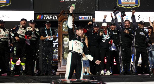 MARTINSVILLE, VIRGINIA - OCTOBER 30: Chandler Smith, driver of the #38 QuickTie/Cole Swindell Ford, celebrates in victory lane after winning the NASCAR Craftsman Truck Series Black's Tire 200 presented by Down East Heating & Air Conditioning at Martinsville Speedway on October 30, 2026 in Martinsville, Virginia. (Photo by Meg Oliphant/Getty Images) | Getty Images