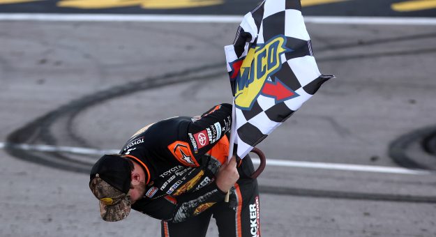 LAS VEGAS, NEVADA - OCTOBER 04: Chase Briscoe, driver of the #19 Bass Pro Shops Toyota, takes a bow in tribute to the late Kyle Busch after winning the NASCAR Cup Series South Point 400 at Las Vegas Motor Speedway on October 04, 2026 in Las Vegas, Nevada. (Photo by Chris Graythen/Getty Images) | Getty Images