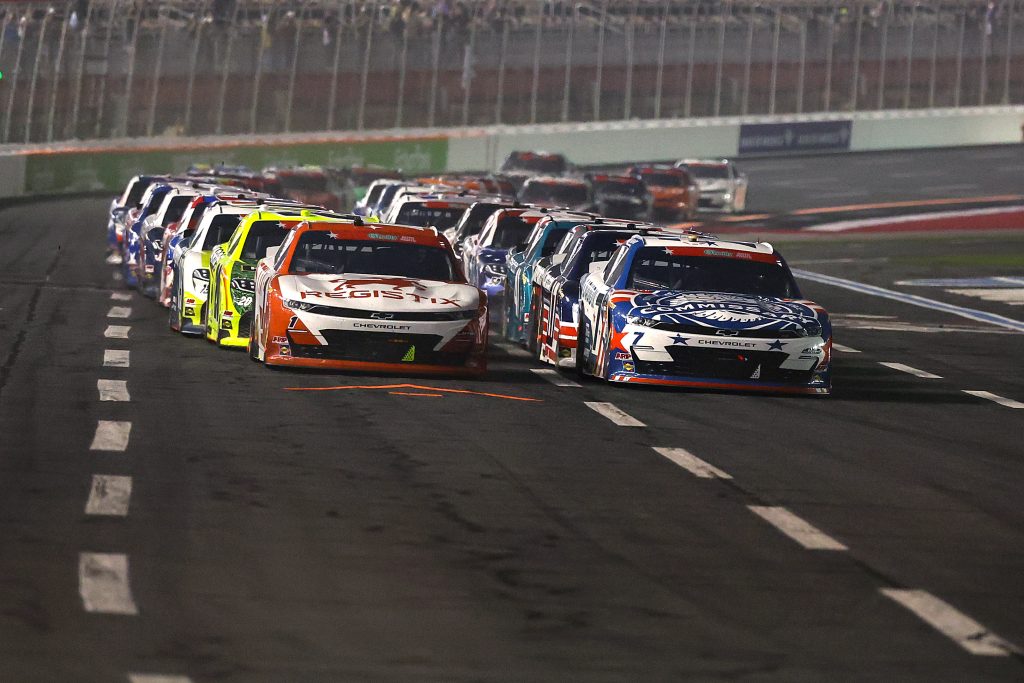 CONCORD, NORTH CAROLINA - MAY 23: Justin Allgaier, driver of the #7 Liquid IV/Hellmann's/Commissary Chevrolet, and Connor Zilisch, driver of the #1 Registix Chevrolet, lead the field during the NASCAR O'Reilly Auto Parts Series Charbroil 300 at Charlotte Motor Speedway on May 23, 2026 in Concord, North Carolina. (Photo by David Jensen/Getty Images) | Getty Images