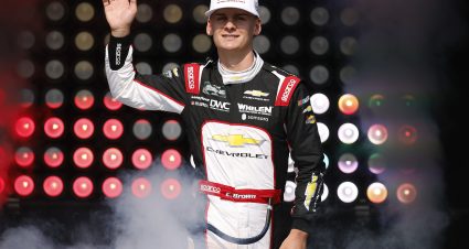 NEWTON, IOWA - AUGUST 08: Carson Brown, driver of the #32 DWC Distributor Wire & Cable Chevrolet, waves to fans as he walks onstage during driver intros prior to the NASCAR O'Reilly Auto Parts Series HyVee Perks 250 at Iowa Speedway on August 08, 2026 in Newton, Iowa. (Photo by Sean Gardner/Getty Images) | Getty Images
