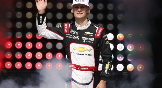 NEWTON, IOWA - AUGUST 08: Carson Brown, driver of the #32 DWC Distributor Wire & Cable Chevrolet, waves to fans as he walks onstage during driver intros prior to the NASCAR O'Reilly Auto Parts Series HyVee Perks 250 at Iowa Speedway on August 08, 2026 in Newton, Iowa. (Photo by Sean Gardner/Getty Images) | Getty Images
