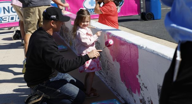 Ryan Preece And His Daughter Paint Pit Wall During Charlotte Motor Speedway's Paint Pit Wall Pink Event On Tuesday