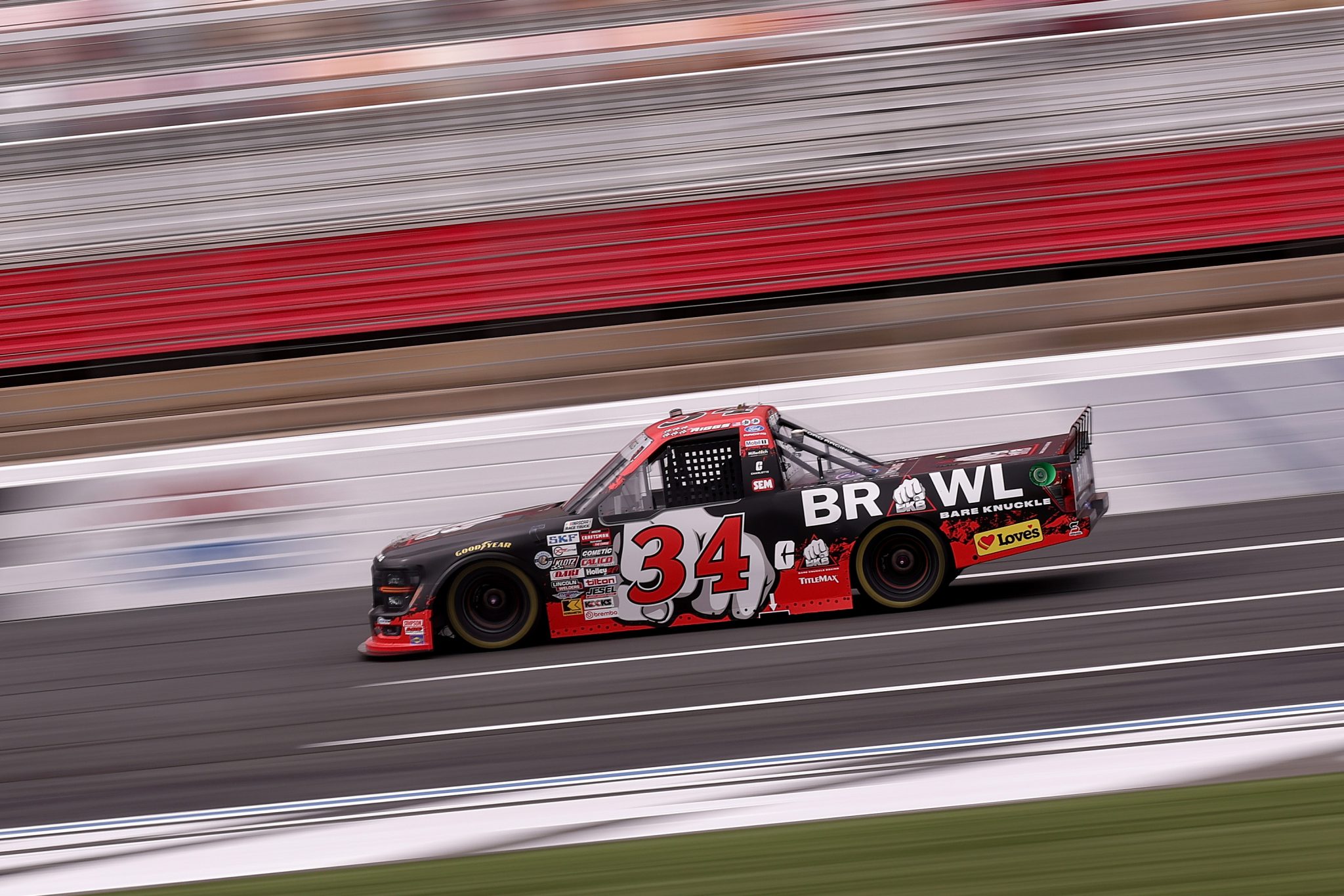 CONCORD, NORTH CAROLINA - OCTOBER 09: Layne Riggs, driver of the #34 BKB Bare Knuckle Boxing Ford, drives during practice for the NASCAR Craftsman Truck Series Ecosave 200 at Charlotte Motor Speedway on October 09, 2026 in Concord, North Carolina. (Photo by David Jensen/Getty Images) | Getty Images
