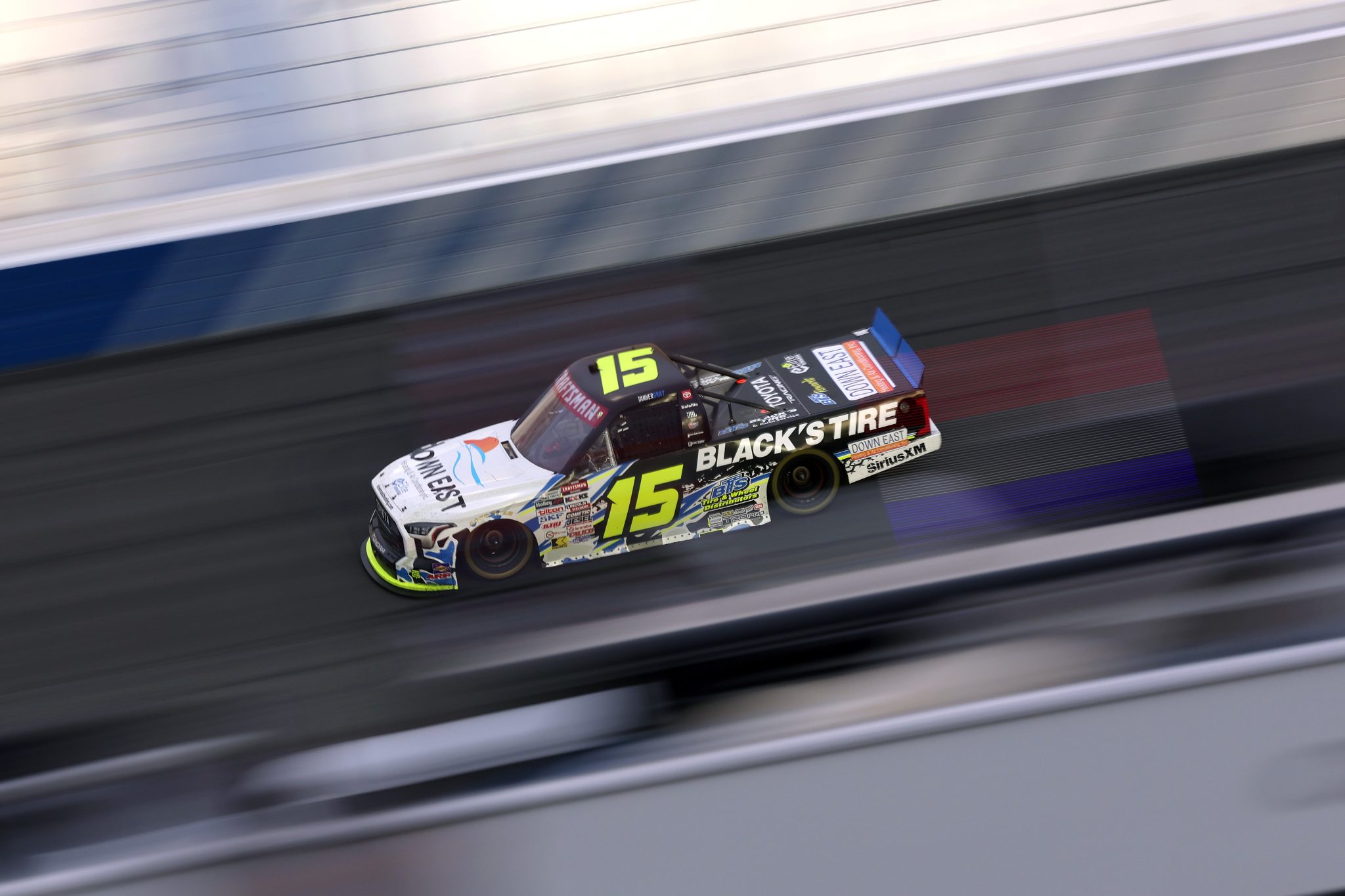 CONCORD, NORTH CAROLINA - OCTOBER 09: Tanner Gray, driver of the #15 Black's Tire/Down East Heating & Air Toyota, drives during the NASCAR Craftsman Truck Series Ecosave 200 at Charlotte Motor Speedway on October 09, 2026 in Concord, North Carolina. (Photo by David Jensen/Getty Images) | Getty Images