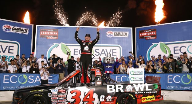 CONCORD, NORTH CAROLINA - OCTOBER 09: Layne Riggs, driver of the #34 BKB Bare Knuckle Boxing Ford, celebrates in victory lane after winning the NASCAR Craftsman Truck Series Ecosave 200 at Charlotte Motor Speedway on October 09, 2026 in Concord, North Carolina. (Photo by David Jensen/Getty Images) | Getty Images