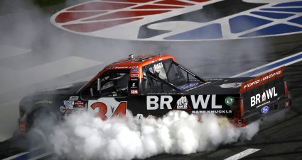 CONCORD, NORTH CAROLINA - OCTOBER 09: Layne Riggs, driver of the #34 BKB Bare Knuckle Boxing Ford, celebrates with a burnout after winning the NASCAR Craftsman Truck Series Ecosave 200 at Charlotte Motor Speedway on October 09, 2026 in Concord, North Carolina. (Photo by Jared C. Tilton/Getty Images) | Getty Images